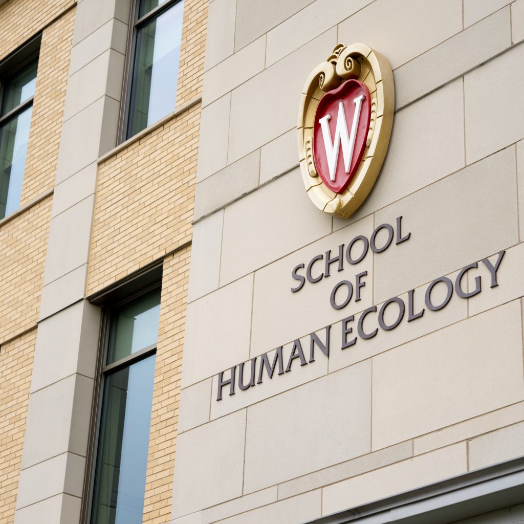 UW Madison Crest on the outside of the School of Human Ecology building