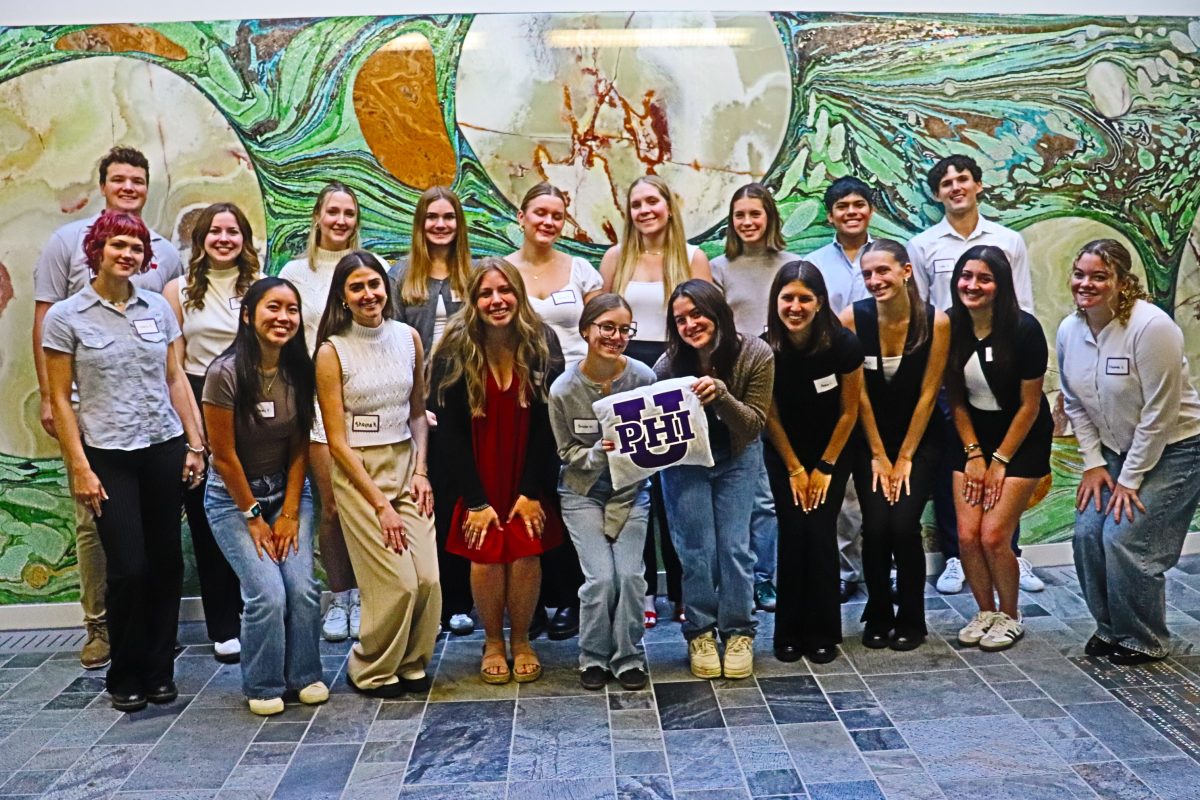 Students from Phi Upsilon Omicron standing in a group smiling.