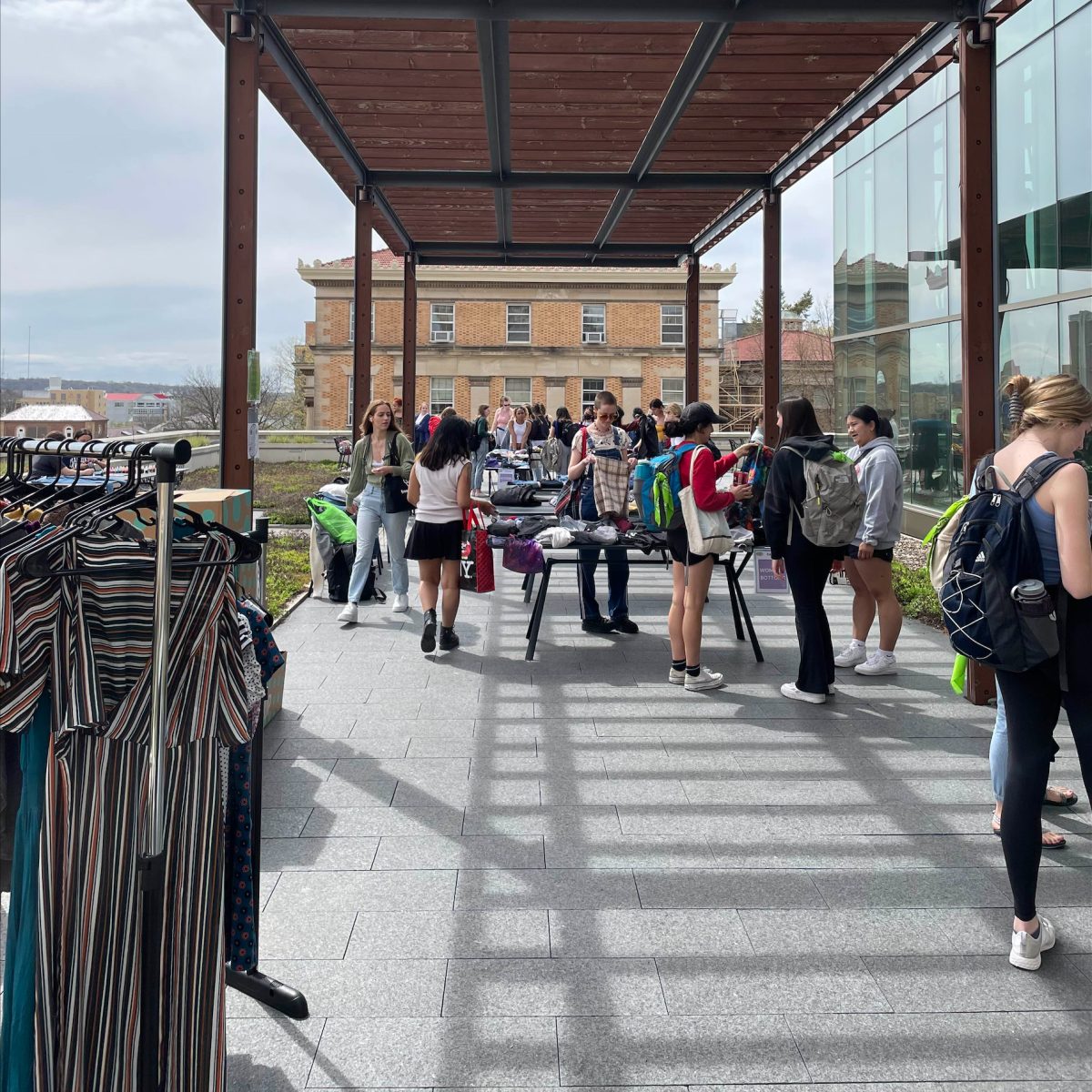 Students from Re-Wear It on the SoHE patio during a clothing swap